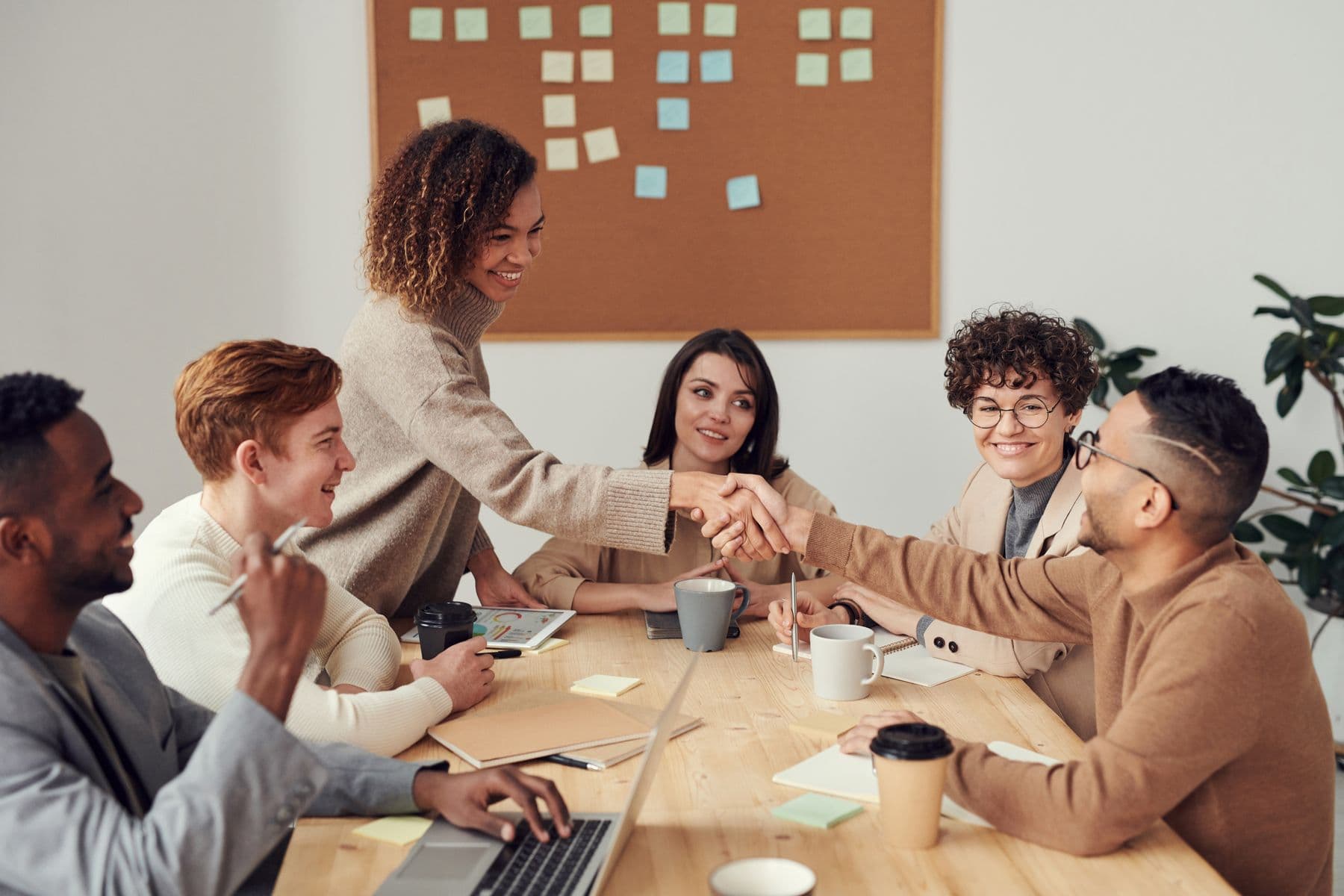 People collaborating on a laptop planning an event